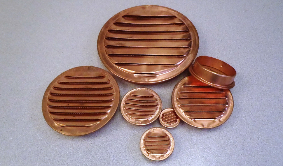 A collection of round copper vents.
